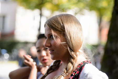 MUNICH, GERMANY - OCT 2, 2017: Unidentified girl in traditional Bavarian costume at the Octoberfest,  the world's largest beer festivalのeditorial素材