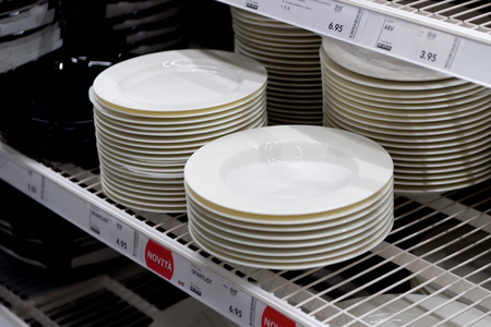 LUGANO, SWITZERLAND -NOV 4, 2017: Plates in the IKEA shop in Lugano, Switzerland. The company was...