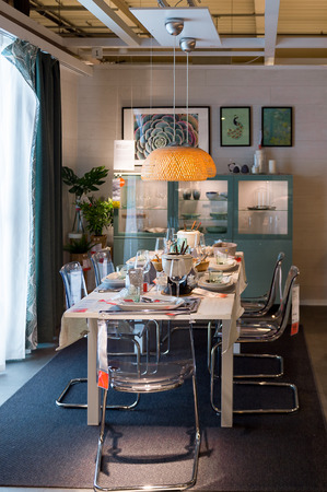 LUGANO, SWITZERLAND -NOV 4, 2017: Dinner table in the IKEA shop in Lugano, Switzerland. The company was found in Sweden in 1943のeditorial素材