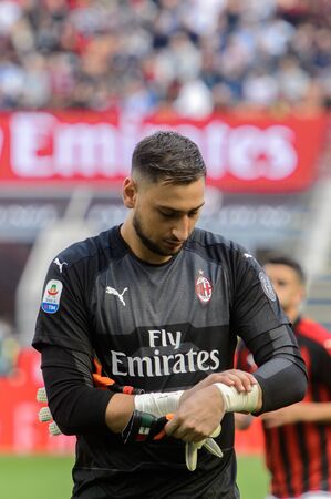 MILAN - OCT 7, 2018: Gianluigi Donnarumma puts on his gloves. AC Milan - Chievo. San Siro stadium. Serie A.のeditorial素材