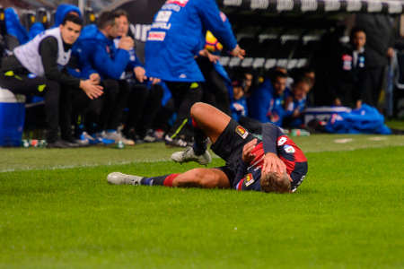 GENOVA - NOV 10, 2018:  4 Domenico Criscito hurt on the grass . C.F.C Genoa - SSC Napoli. Calcio Serie A TIM. Stadium Luigi Ferraris.のeditorial素材