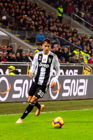 MILAN - NOV 11, 2018: Rodrigo Bentancur 30 does a cross. AC Milan - Juventus. Italian Serie A TIM. Giuseppe Meazza Stadiumのeditorial素材