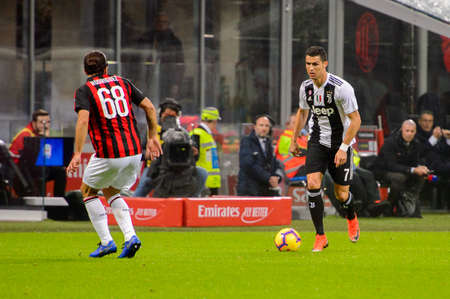 MILAN - NOV 11, 2018: Cristiano Ronaldo 7 attacks. AC Milan - Juventus. Italian Serie A TIM. Giuseppe Meazza Stadiumのeditorial素材