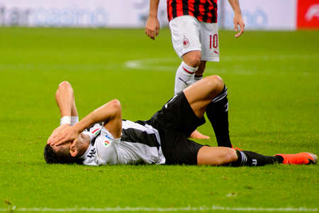 MILAN - NOV 11, 2018: Cristiano Ronaldo 7 is injured on the grass. AC Milan - Juventus. Italian Serie A TIM. Giuseppe Meazza Stadiumのeditorial素材