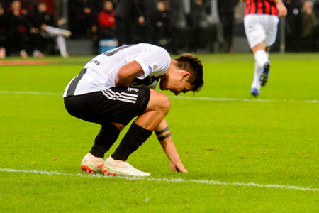 MILAN - NOV 11, 2018: Paulo Dybala 10 on the grass. AC Milan - Juventus. Italian Serie A TIM. Giuseppe Meazza Stadiumのeditorial素材