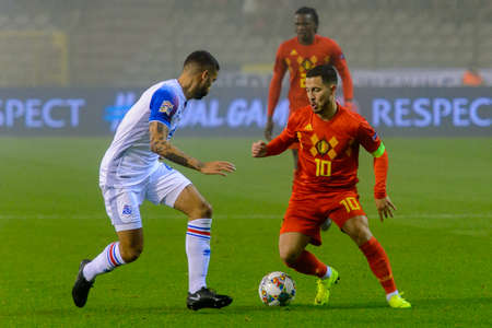 BRUSSELS - NOV 15, 2018: Eden Hazard 10 does dribbling.  Belgium - Iceland. UEFA Nations League.のeditorial素材
