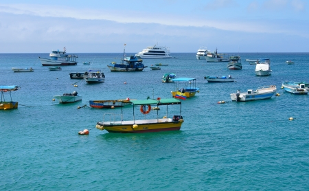 Boats anchored in Puerto Baquerizo on San Cristobal Island in the Galapagos, Ecuador のeditorial素材