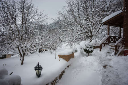 Snow-covered village in the mountains. Winter at Trikala Korinthias, Peloponnese, Greeceの写真素材