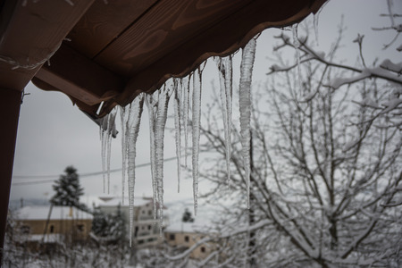 Snow-covered village in the mountains. Winter at Trikala Korinthias, Peloponnese, Greeceの写真素材
