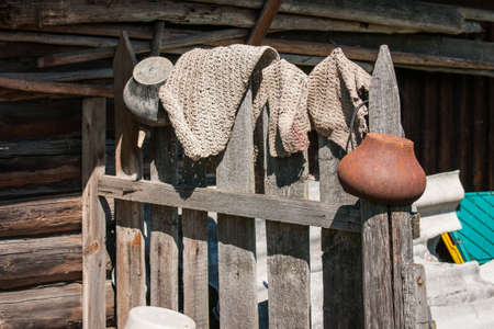 Image of rustic fence, pots and rugs in Palekh, Vladimir region, Russiaの写真素材
