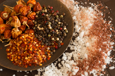 Kitchen still life with salt, pepper and spices