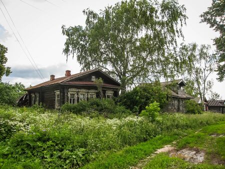 Image of a village house and surrounding landscape in Palekh, Vladimir region, Russiaの写真素材