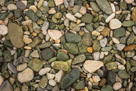 Image of brightly colored green stones at Illia beach, Evia, Greeceの写真素材