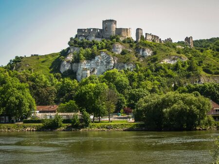 Scenic ruins of an ancient castle on the river shore, Les Andeles, Franceの写真素材