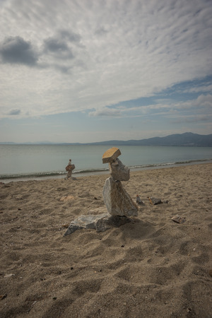 Image of amazing pyramid of stones on the beach in Schinias, Attica, Greeceの写真素材