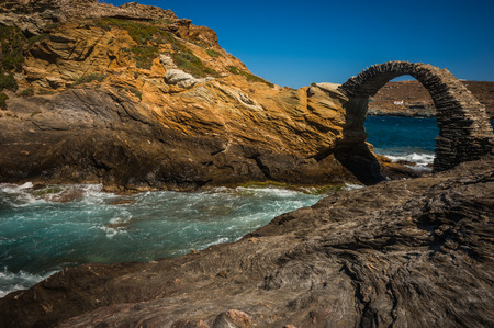 Scenic view to ancient bridge to small island near the town of Andros, Andros, Greeceの写真素材