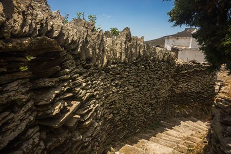 Image of fence made of masonry and a staircase on the island of Andros, Greeceの写真素材