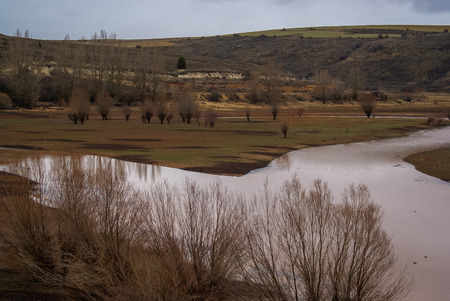 Unusual orange color of the water in the river, Pueblos rojos, Castilla y Leon, Spainの写真素材