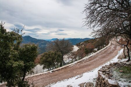 Winter landscape with a snow in the mountains near Vassa, Greeceの写真素材