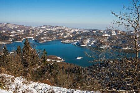Winter scenic snowy landscape with lake Plastira, Fesalia, Greeceの写真素材