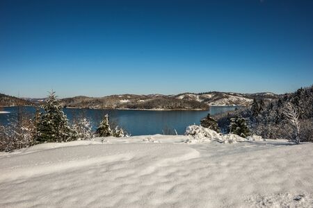 Winter scenic snowy landscape with lake Plastira, Fesalia, Greeceの写真素材