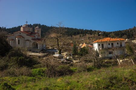 Image of sliding village Ropoto and church after a landslide in Greece