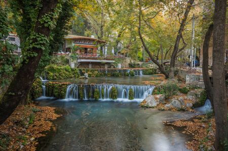 Autumn landscape with a river and small house, Livadia, Greeceの写真素材