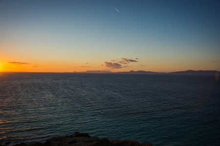 Image of a sunset at the sea near Rodos town in Greeceの写真素材
