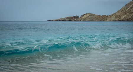 Picturesque Petani beach and the waves on the island of Kefalonia in Greeceの写真素材