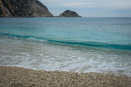 Picturesque Petani beach and the waves on the island of Kefalonia in Greeceの写真素材