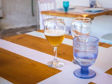 Image of glasses with cold beer and water on the tableの写真素材