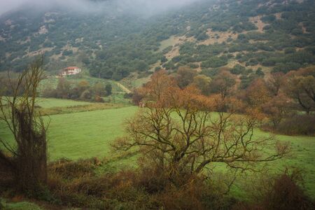 Scenic foggy autumn landscape in Vouraikos gorge near railway, Peloponnesse, Greeceの写真素材