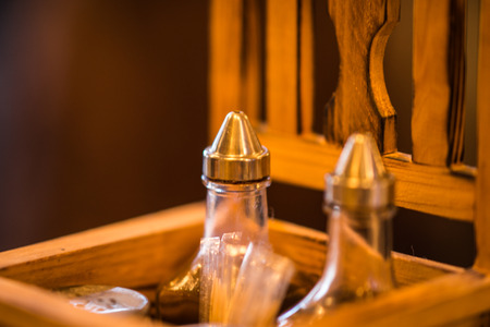 Image of spices in a wooden box in the shape of chair