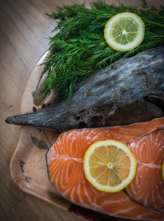 Image of a sturgeon decorated with lemon and dill and parsleyの写真素材