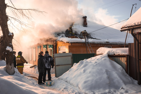 Pereslavl Zalessky, Russia - February 23, 2018, Fire extinguishing in  village house in Pereslavl Zalessky, Russiaのeditorial素材