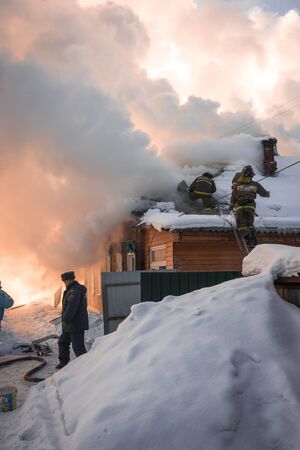 Pereslavl Zalessky, Russia - February 23, 2018, Fire extinguishing in  village house in Pereslavl Zalessky, Russiaのeditorial素材