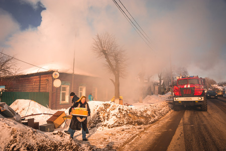 Pereslavl Zalessky, Russia - February 23, 2018, Fire extinguishing in  village house in Pereslavl...
