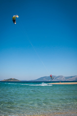Golden beach at Marmari, Greece - June 24, 2012, Sky-surfers playing on Golden beach in Marmari on Evia island in Greece in  Greeceのeditorial素材