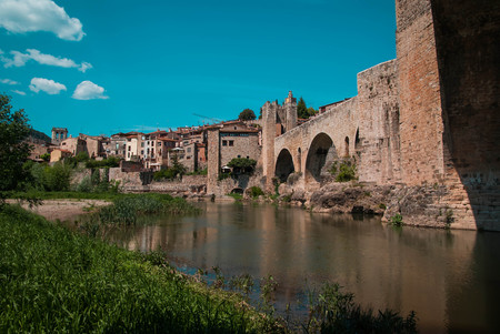 Scenic image of medieval bridge over river El Fluvia near Besalu in Spainの写真素材
