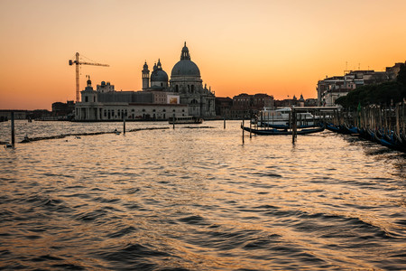 Scenic image of picturesque chanels of Venice at sunset in Italyの写真素材