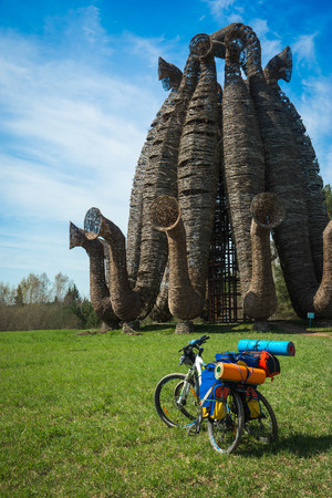 Two bicycles with luggage on meadow in Kaluga region in Russiaの写真素材
