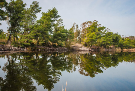 Image of beautiful shores of Kaifa lake and their reflections in water on Peloponnese in Greeceの写真素材
