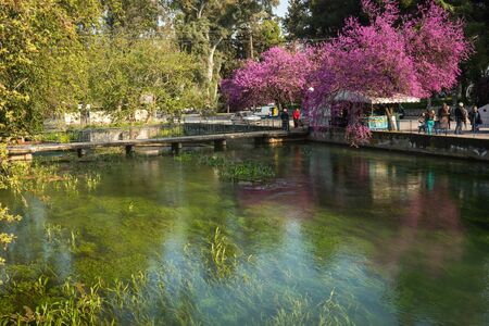 Kefalary, Greece - March 30, 2014: People resting near river at Kefalary, Greeceのeditorial素材