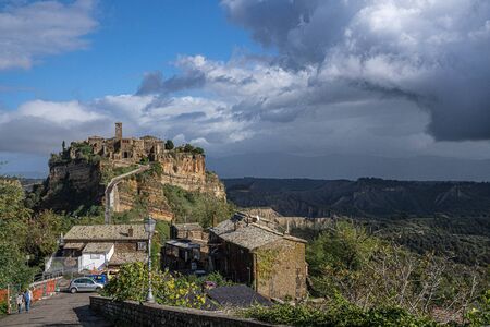 Civita di Bagnoregio, Italy - November 04, 2019, People on the brige to Civita di Bagnoregio in Lazio in Italyのeditorial素材