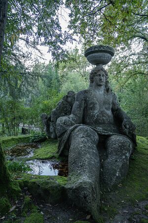 Medieval stone figures in a monster park in Bomarzo in Lazio in Italy