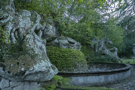 Medieval stone figures in a monster park in Bomarzo in Lazio in Italyの写真素材