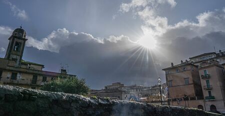 Scenic clouds over the city of Bracciano in Lazio in Italyの写真素材