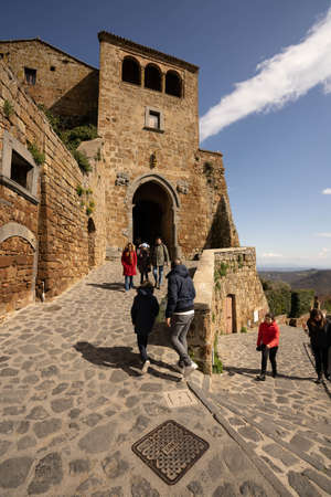 Civita di Bagnoregio, Italy - March 08, 2020, People on the brige to Civita di Bagnoregio in Lazio...