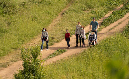 Rome, Italy - May 05, 2020, People in masks and without masks on a walk in a park in Rome, Italyのeditorial素材