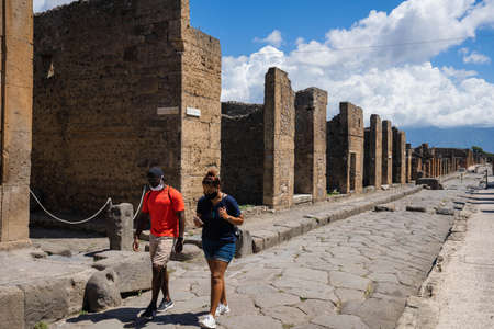 Pompei, Italy - June 14, 2020, Masked people walking on the ruins of Pompeii during isolation due to coronavirusのeditorial素材